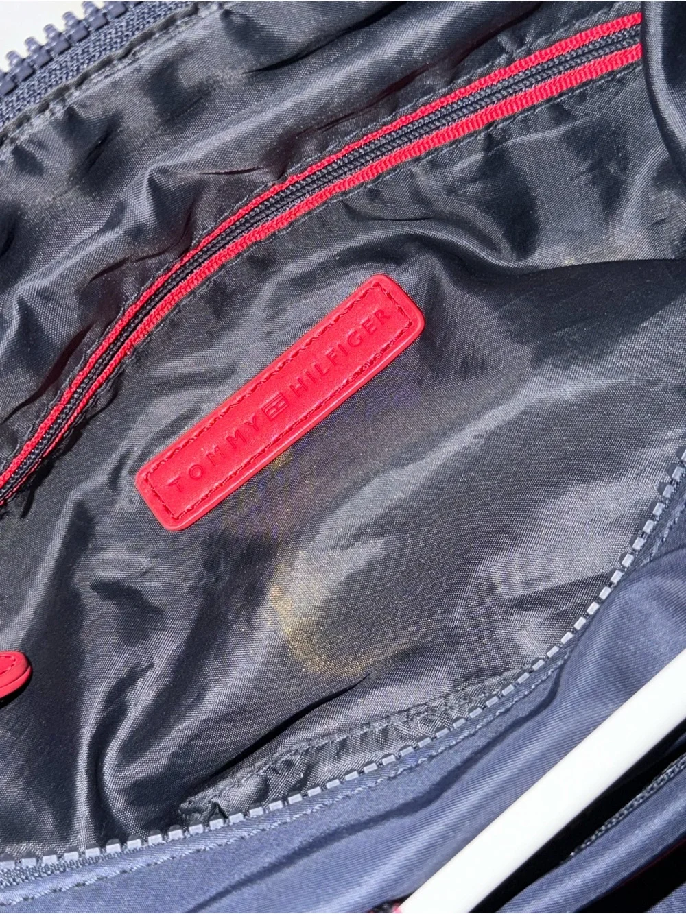 Tommy Hilfiger navy blue backpack with red accents